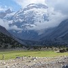 Simply gorgeous: the contrast between the lovely, green valley and the huge, rough and intimidating mountain in the background.